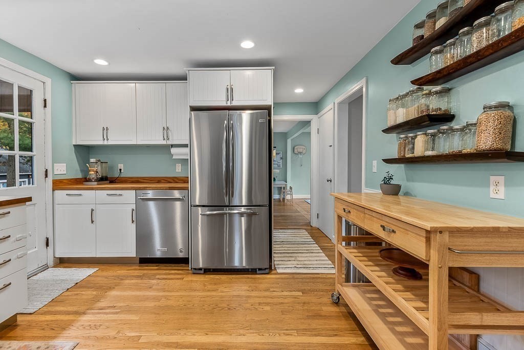 34 Cranberry Lane Dedham, MA 02026 - Photo 14 of 38 a kitchen with kitchen island a counter top space a sink stainless steel appliances and cabinets