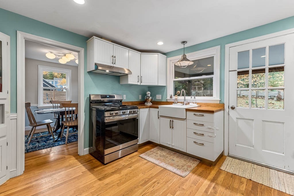 34 Cranberry Lane Dedham, MA 02026 - Photo 16 of 38 a kitchen with stainless steel appliances a stove a sink and a refrigerator