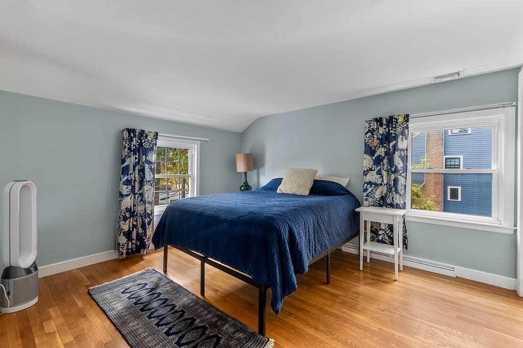 34 Cranberry Lane Dedham, MA 02026 - Photo 20 of 38 a bed sitting in a bedroom next to a window