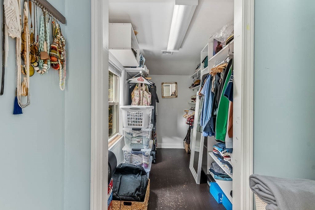 34 Cranberry Lane Dedham, MA 02026 - Photo 21 of 38 a view of walk in closet with clothes and shoes