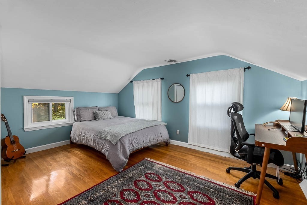 34 Cranberry Lane Dedham, MA 02026 - Photo 26 of 38 a bedroom with a bed and wooden floor