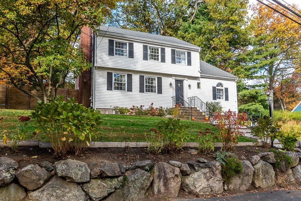 34 Cranberry Lane Dedham, MA 02026 - Photo 4 of 38 a front view of a house with garden