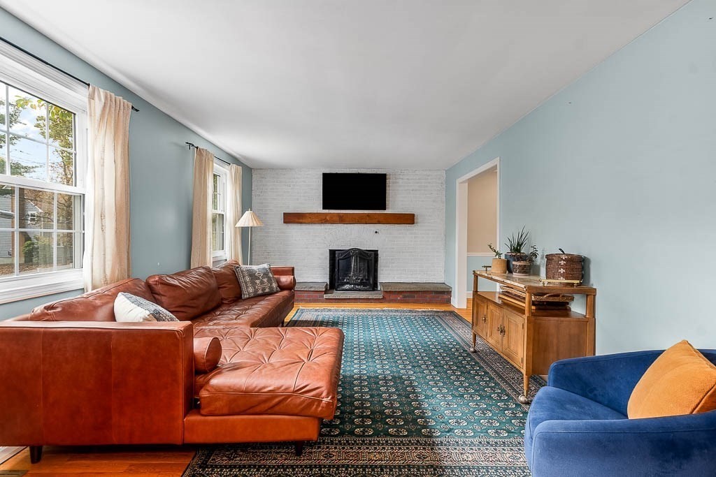34 Cranberry Lane Dedham, MA 02026 - Photo 5 of 38 a living room with furniture and a fireplace