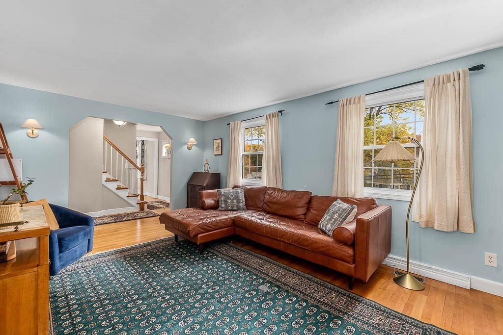 34 Cranberry Lane Dedham, MA 02026 - Photo 7 of 38 a living room with furniture and a window