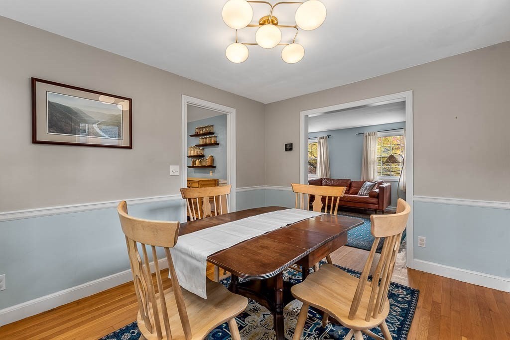 34 Cranberry Lane Dedham, MA 02026 - Photo 9 of 38 a view of a dining room with furniture and wooden floor