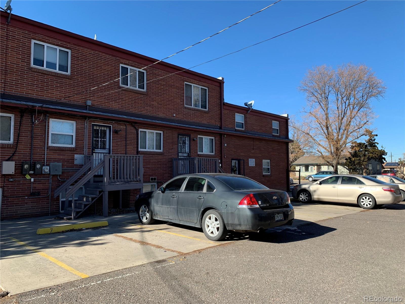 1400 South Clermont Street, Unit 8 Denver, CO 80222 - Photo 11 of 11 a car parked in front of a building