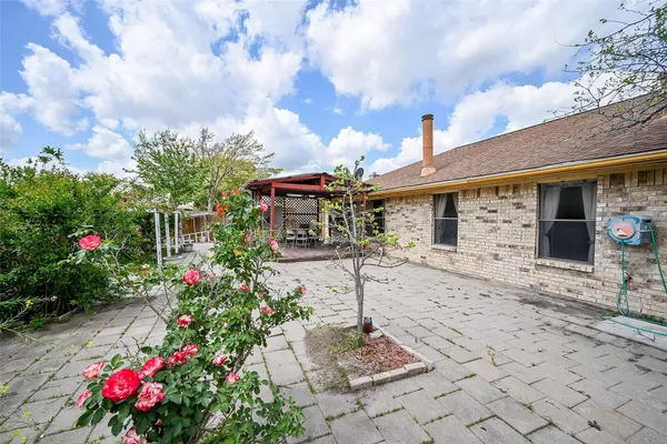 a front view of a house with a porch and a yard
