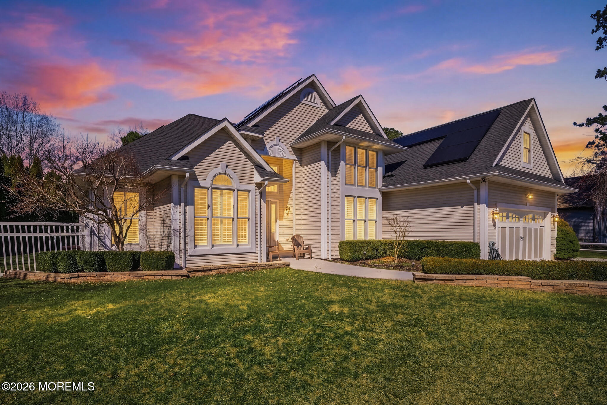 a front view of a house with a yard