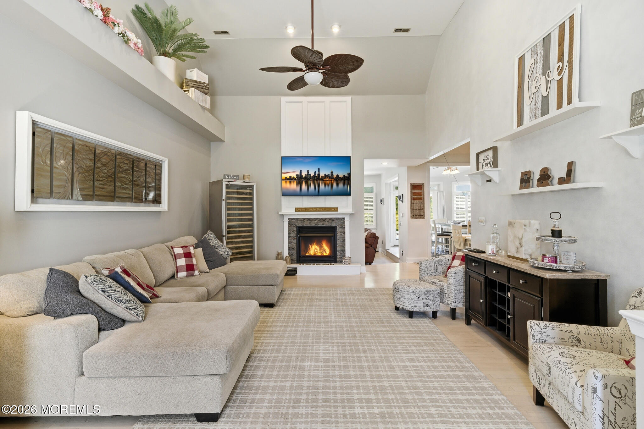 718 Amherst Road Lanoka Harbor, NJ 08734 - Photo 11 of 66 a living room with furniture a fireplace and a chandelier