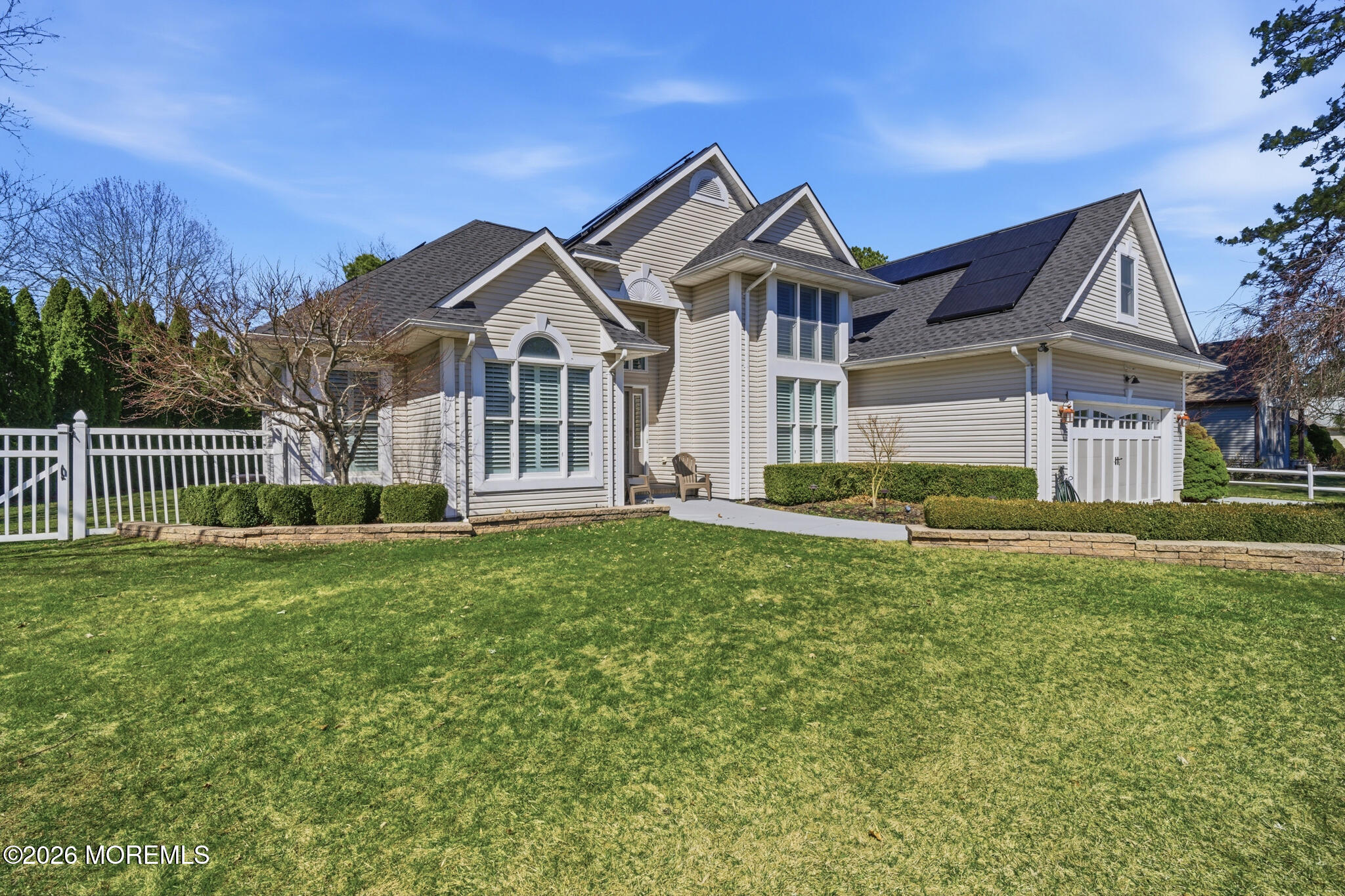 718 Amherst Road Lanoka Harbor, NJ 08734 - Photo 2 of 66 a front view of a house with a garden