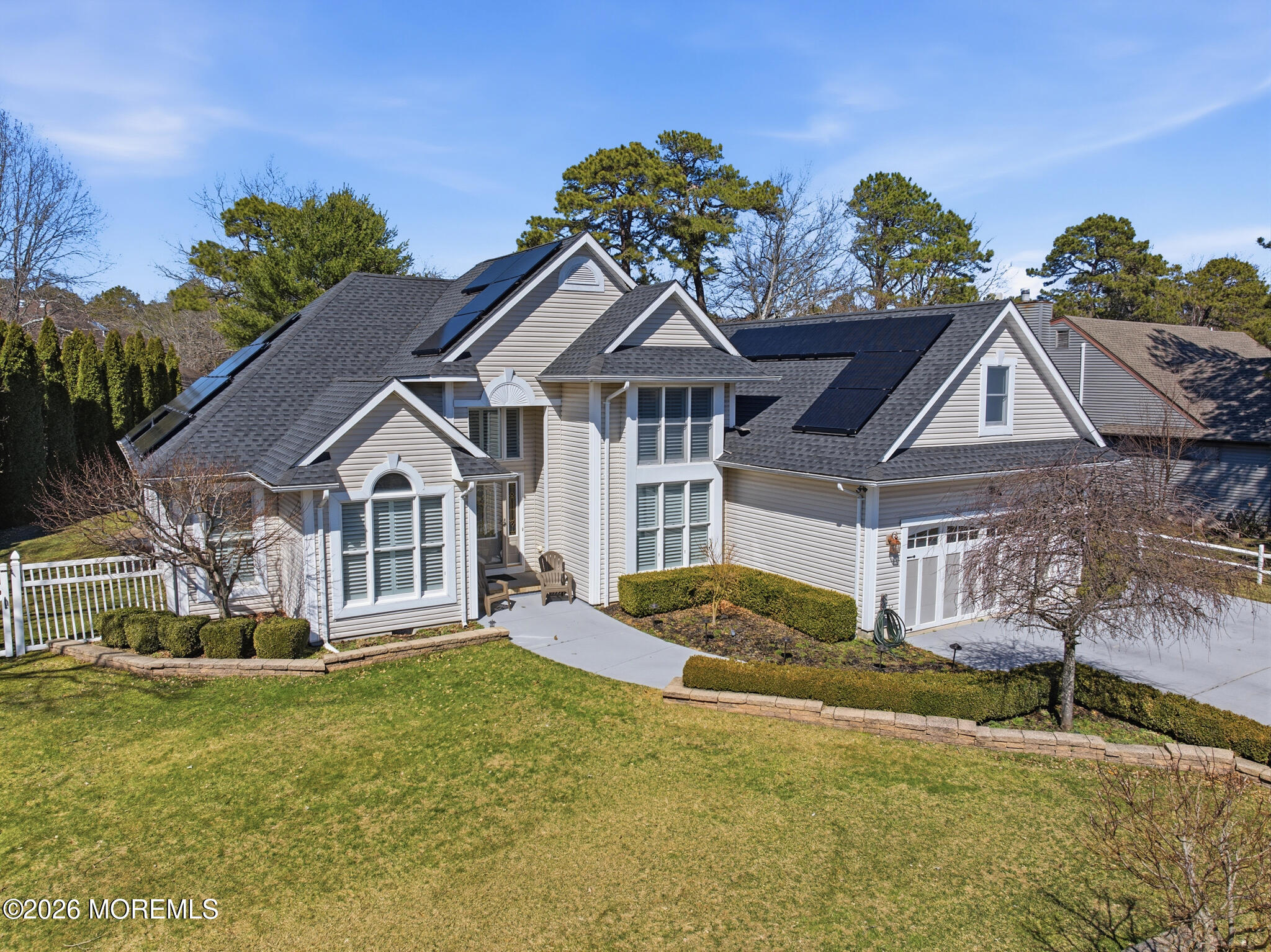 718 Amherst Road Lanoka Harbor, NJ 08734 - Photo 3 of 66 a front view of a house with garden