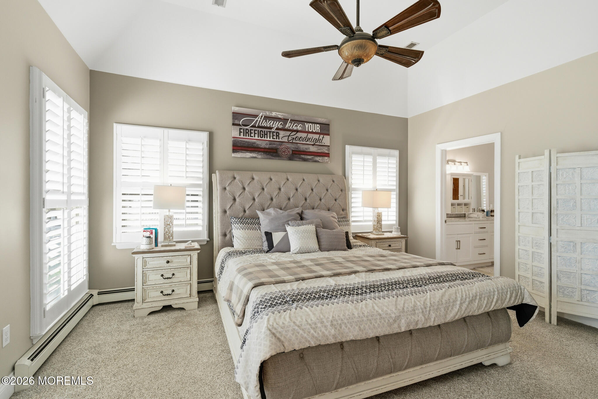 718 Amherst Road Lanoka Harbor, NJ 08734 - Photo 33 of 66 a bedroom with a large bed a chandelier and windows