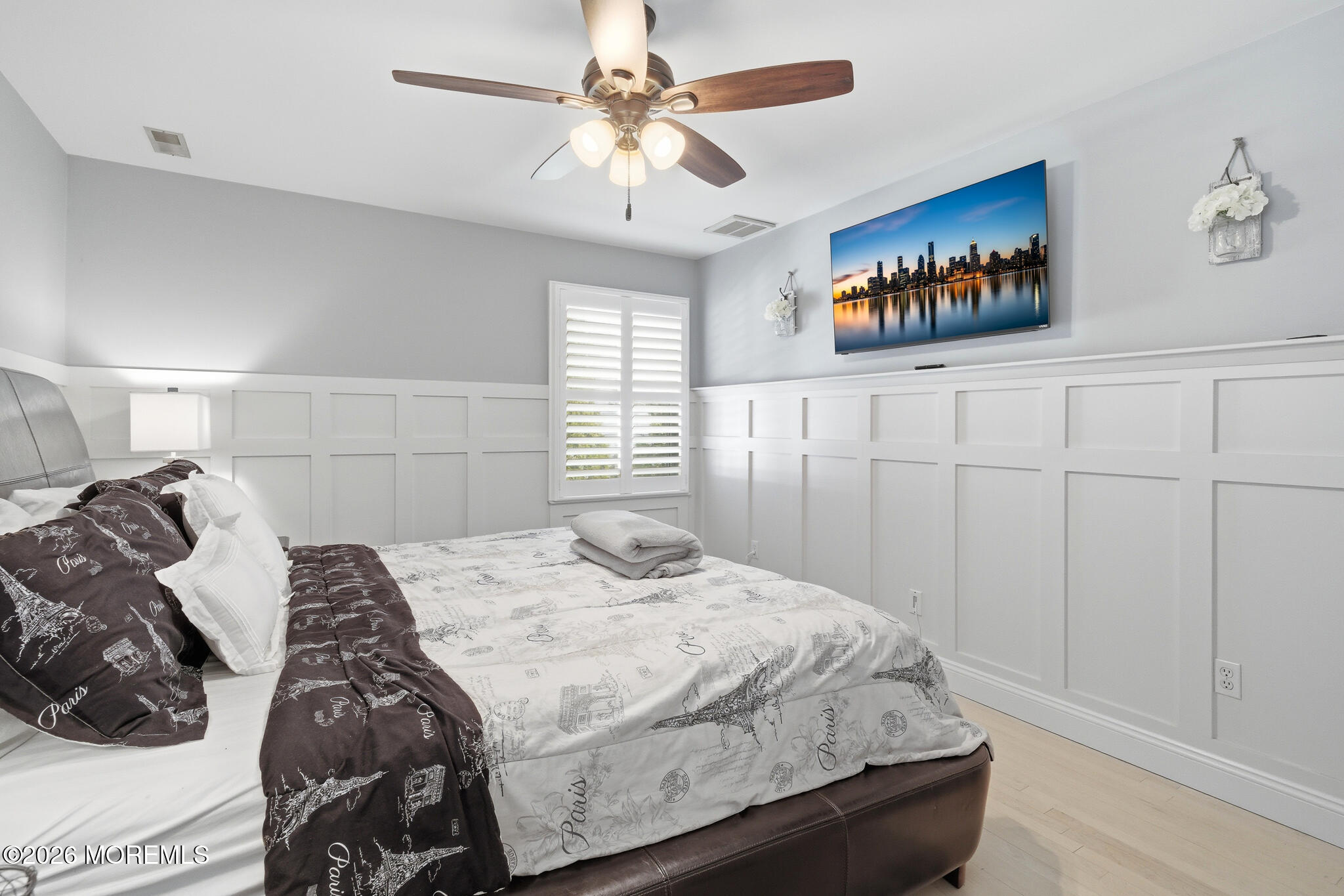718 Amherst Road Lanoka Harbor, NJ 08734 - Photo 42 of 66 a bedroom with a bed and a chandelier