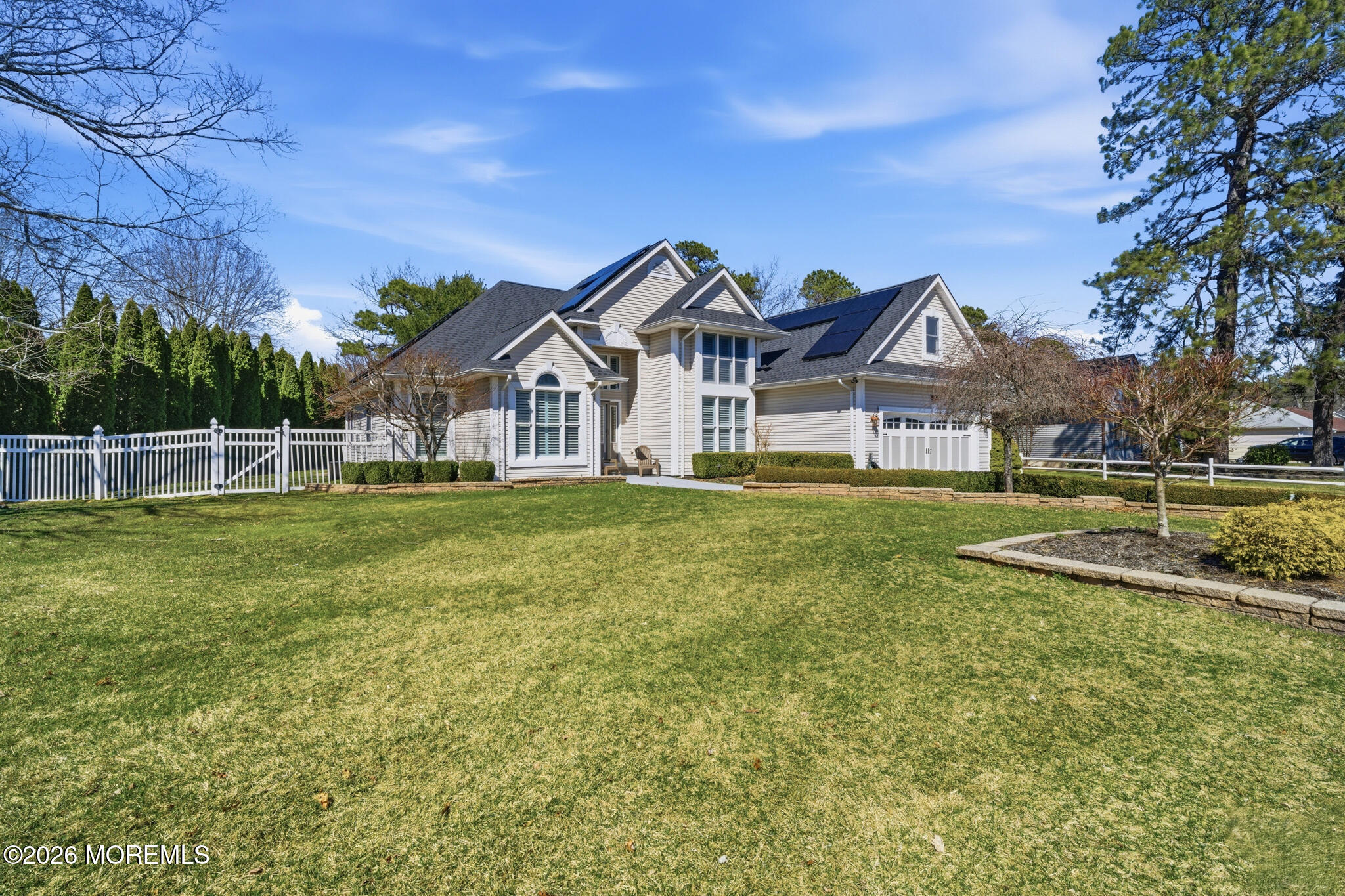 718 Amherst Road Lanoka Harbor, NJ 08734 - Photo 57 of 66 a view of a house with a big yard and large trees