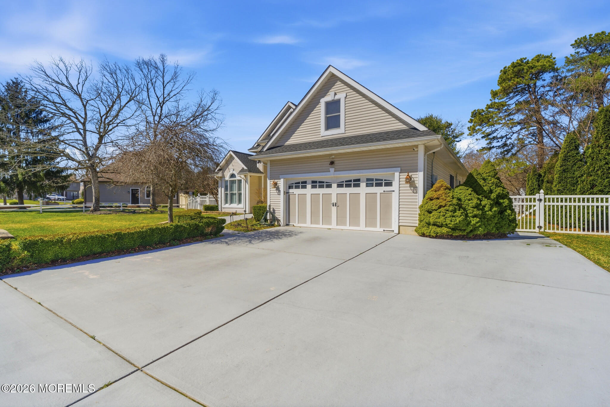 718 Amherst Road Lanoka Harbor, NJ 08734 - Photo 9 of 66 a front view of a house with a yard and garage