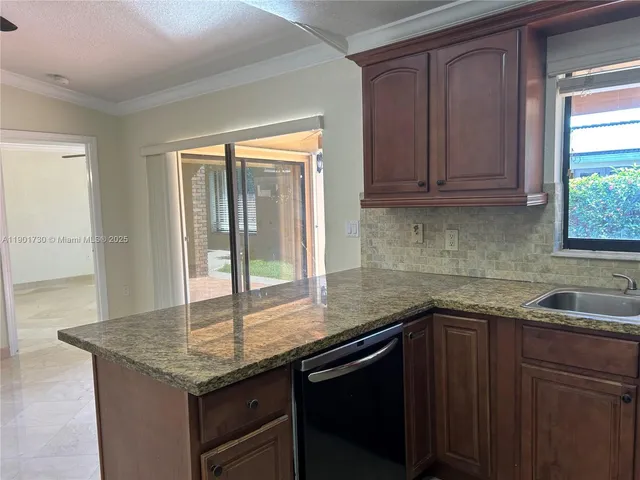 a view of a chandelier fan in a room