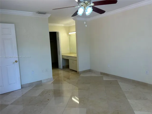 a bathroom with a granite countertop toilet sink and shower
