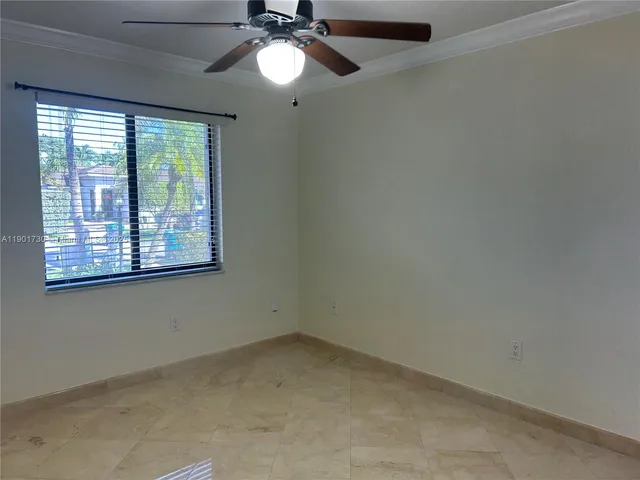 a very nice looking room with a chandelier fan