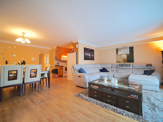 5744 106th Street, Unit 3C Chicago Ridge, IL 60415 - Photo 2 of 19 a living room with furniture and a flat screen tv