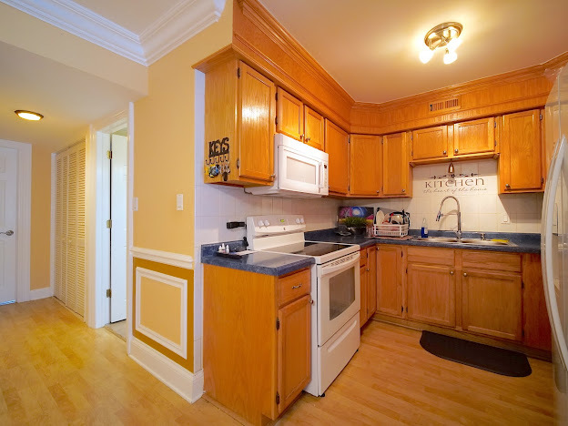 5744 106th Street, Unit 3C Chicago Ridge, IL 60415 - Photo 11 of 19 a kitchen with stainless steel appliances granite countertop a stove a sink and a refrigerator