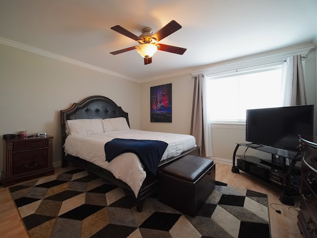 5744 106th Street, Unit 3C Chicago Ridge, IL 60415 - Photo 12 of 19 a living room with furniture and a flat screen tv