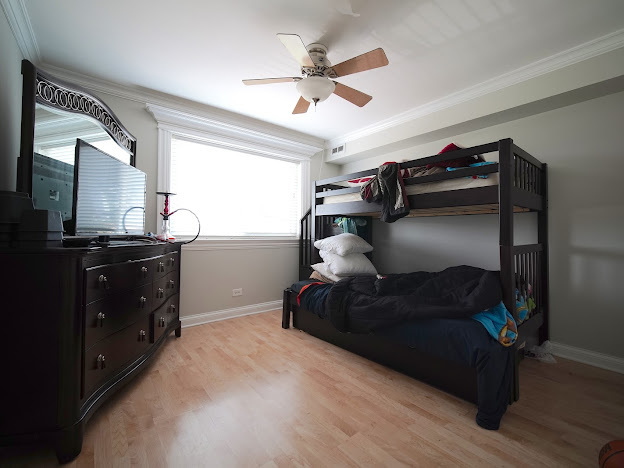 5744 106th Street, Unit 3C Chicago Ridge, IL 60415 - Photo 14 of 19 a living room with furniture and a flat screen tv