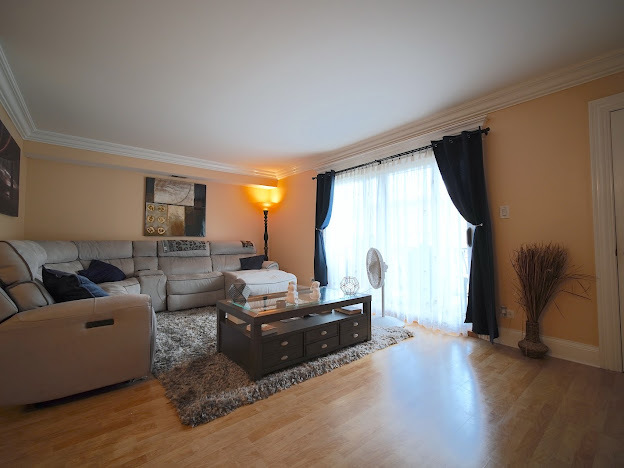 5744 106th Street, Unit 3C Chicago Ridge, IL 60415 - Photo 6 of 19 a living room with furniture and a flat screen tv