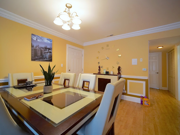 5744 106th Street, Unit 3C Chicago Ridge, IL 60415 - Photo 7 of 19 a view of a dining room with furniture and a chandelier