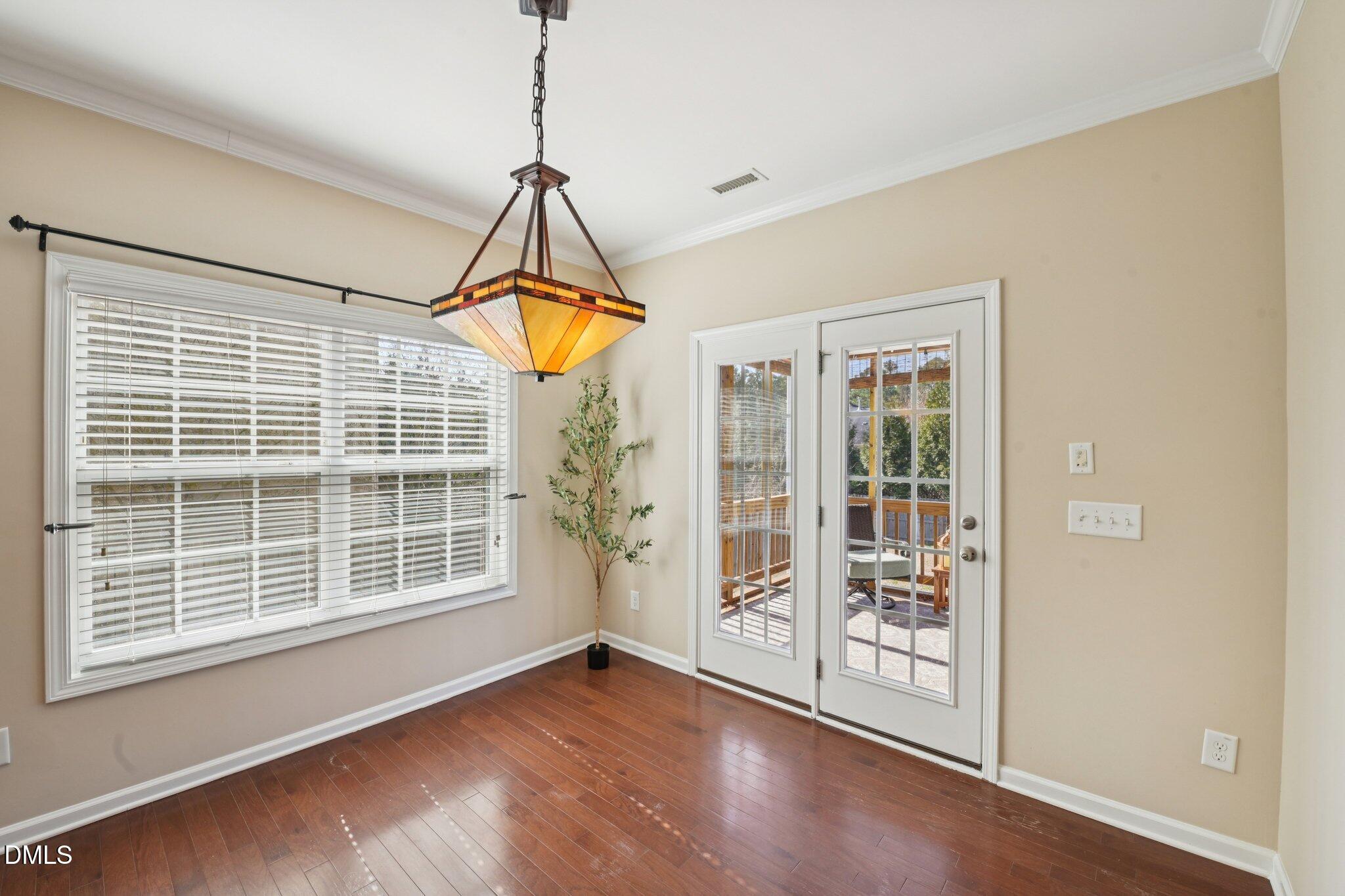 11 Hidden Ridge Court Durham, NC 27707 - Photo 11 of 30 a view of a room with wooden floor and windows