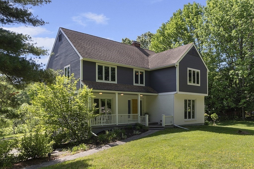 208 Concord Road Lincoln, MA 01773 - Photo 23 of 23 a front view of a house with a yard