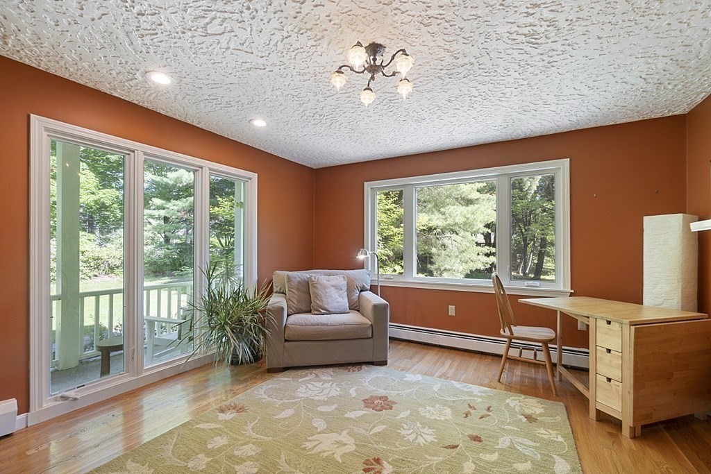 208 Concord Road Lincoln, MA 01773 - Photo 8 of 23 a living room with furniture and a large window