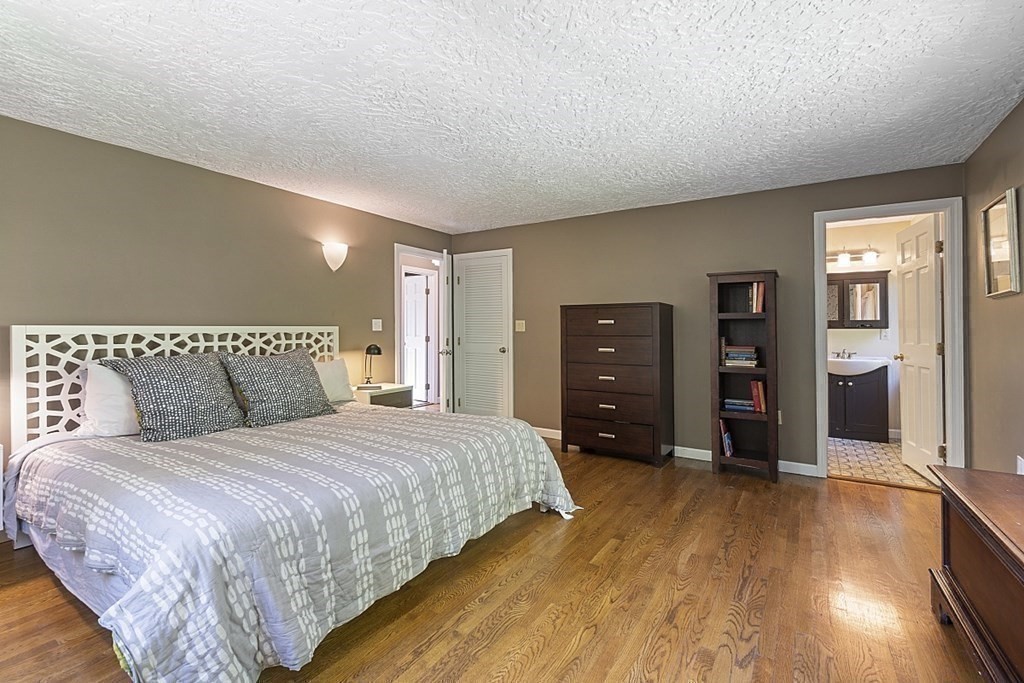 208 Concord Road Lincoln, MA 01773 - Photo 10 of 23 a bedroom with a bed and a dresser
