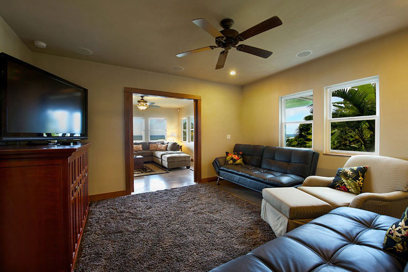 4241 Anini Road Princeville, HI 96722 - Photo 14 of 24 a living room with furniture and a flat screen tv