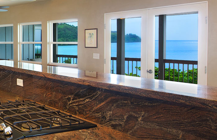 4241 Anini Road Princeville, HI 96722 - Photo 23 of 24 a living room with wooden floor and a large window
