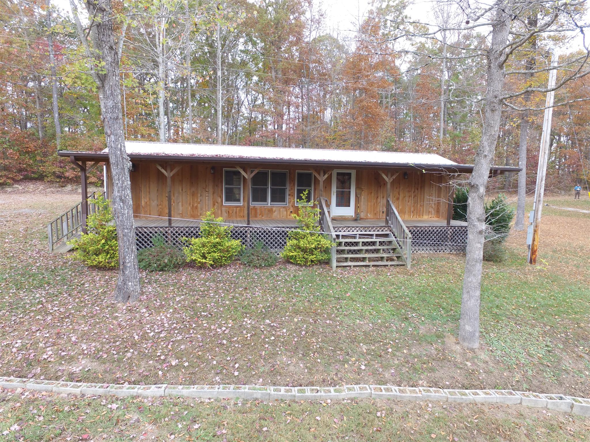 720 Wooten Park Road Red Boiling Springs, TN 37150 - Photo 26 of 29 a front view of a house with garden