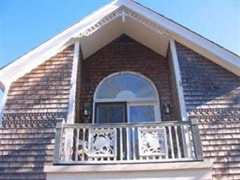 27 Bayview Road Mashpee, MA 02649 - Photo 13 of 35 a front view of a house with garage