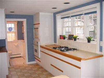 27 Bayview Road Mashpee, MA 02649 - Photo 23 of 35 a kitchen with stainless steel appliances granite countertop a stove and a refrigerator
