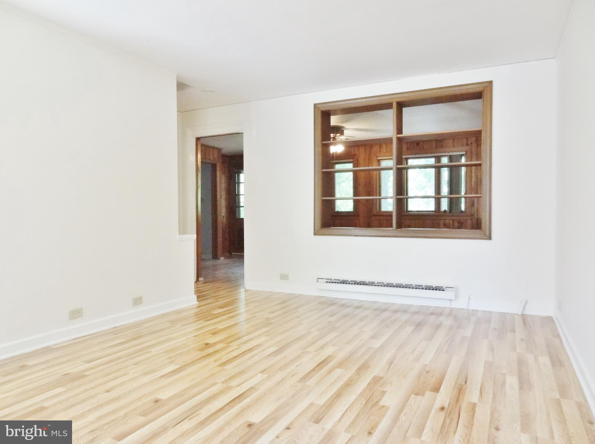 45 Ridge Road, Unit N Greenbelt, MD 20770 - Photo 3 of 19 Living Rm w/Built-In Bookcase See Thru to Addition