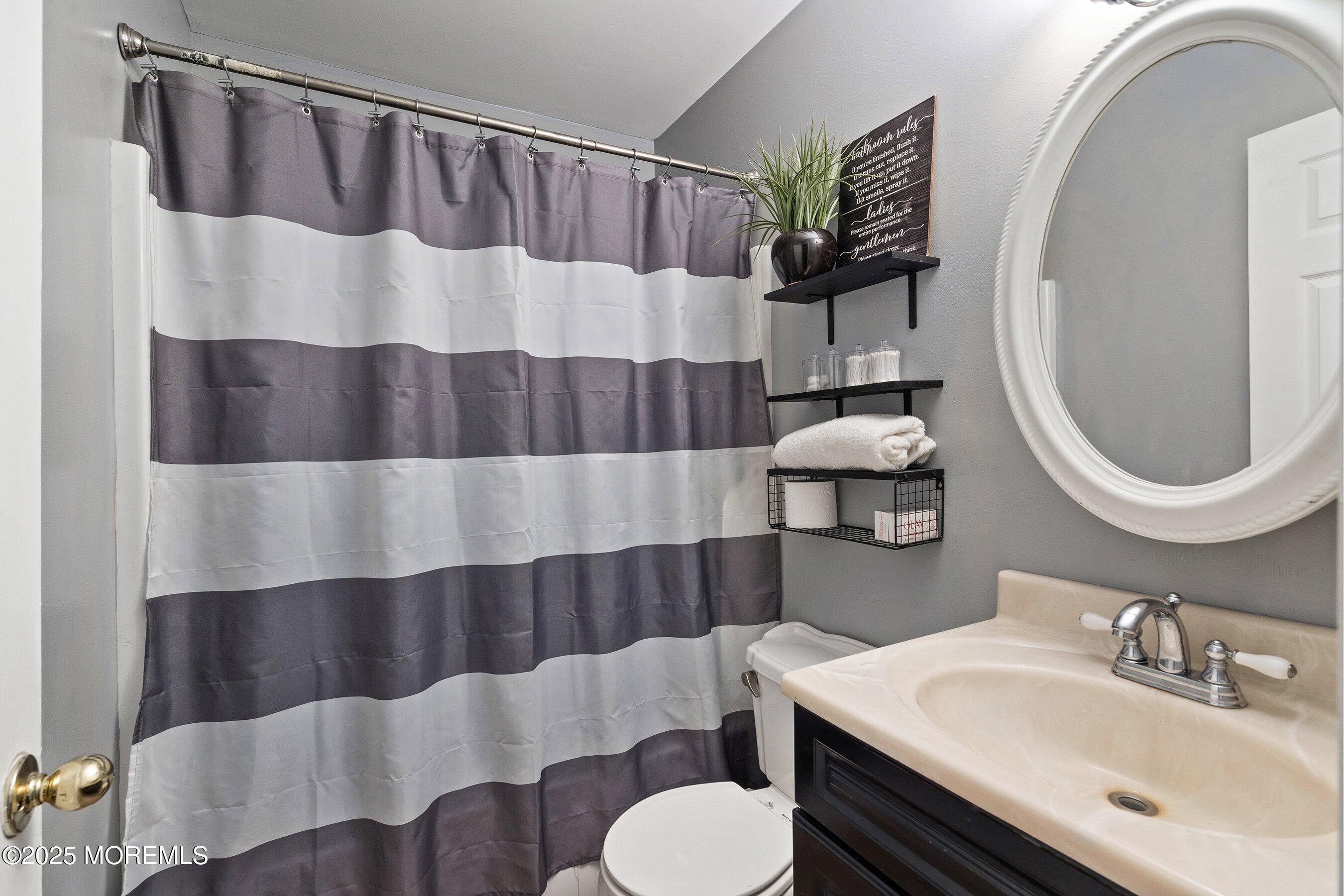 300 Bellanca Road Brick, NJ 08723 - Photo 14 of 23 a bathroom with a sink toilet and shower