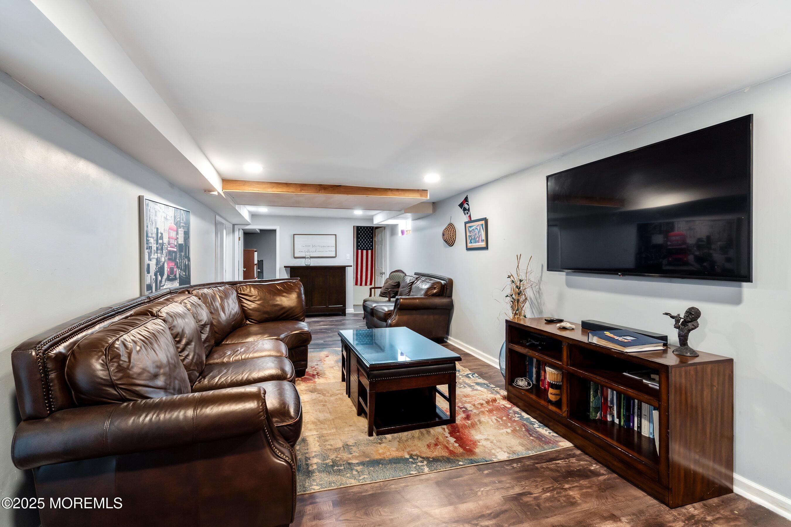 300 Bellanca Road Brick, NJ 08723 - Photo 16 of 23 a living room with furniture and a flat screen tv