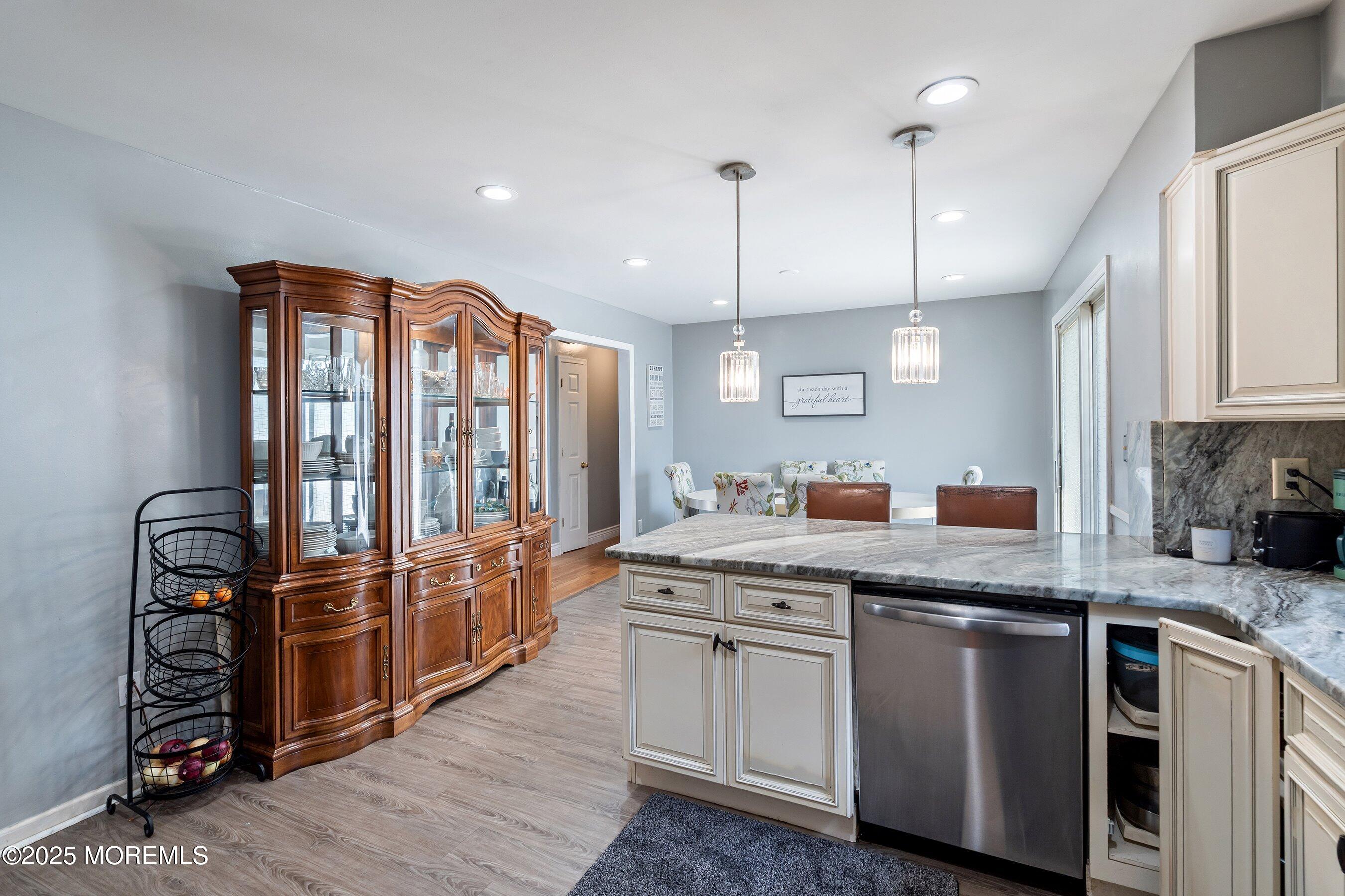 300 Bellanca Road Brick, NJ 08723 - Photo 9 of 23 a kitchen with stainless steel appliances granite countertop a stove a sink and a refrigerator with wooden floor