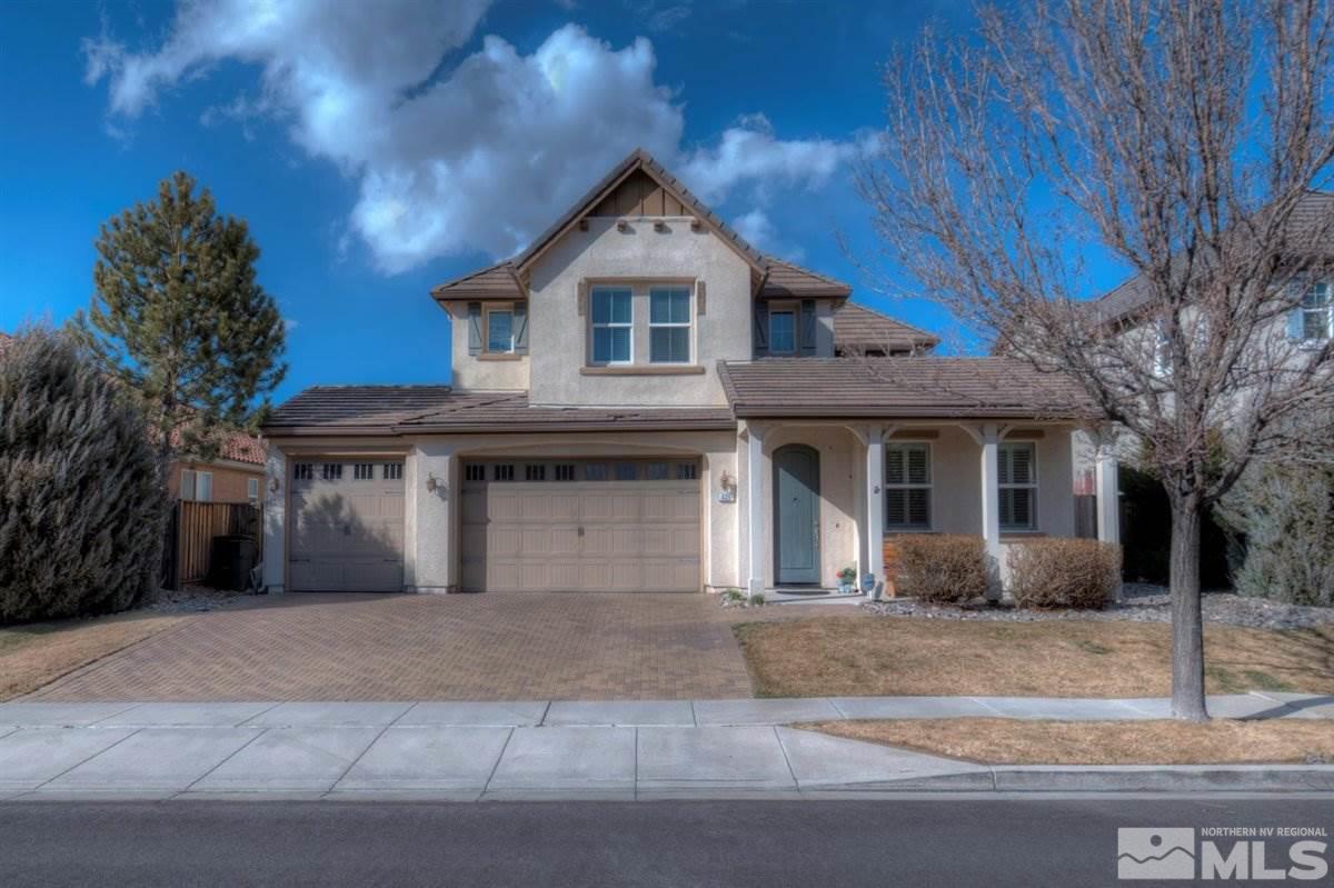 425 Manciano Way Reno, NV 89521 - Photo 1 of 28 a front view of a house with garden
