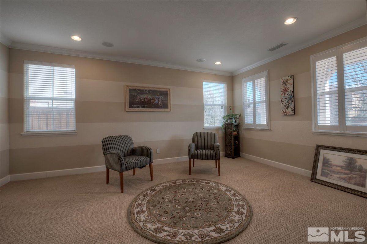 425 Manciano Way Reno, NV 89521 - Photo 12 of 28 a living room with furniture a rug and a window