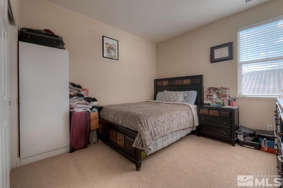 425 Manciano Way Reno, NV 89521 - Photo 19 of 28 a bedroom with a bed and a window
