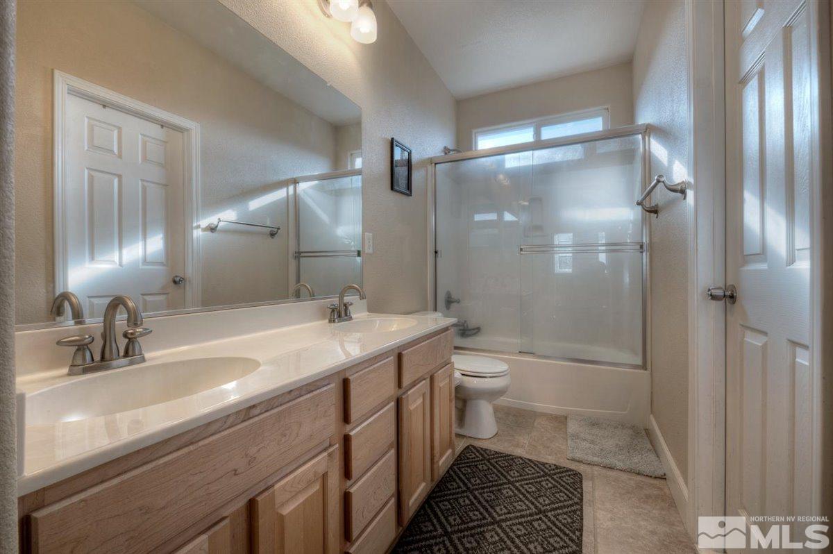 425 Manciano Way Reno, NV 89521 - Photo 20 of 28 a bathroom with a sink a toilet and shower