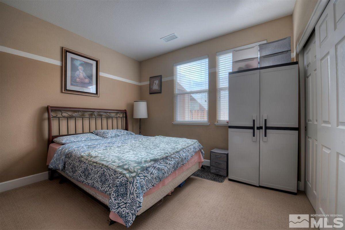 425 Manciano Way Reno, NV 89521 - Photo 22 of 28 a bedroom with a bed and window