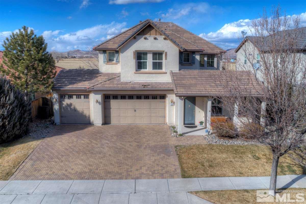 425 Manciano Way Reno, NV 89521 - Photo 28 of 28 a front view of a house with a yard and garage