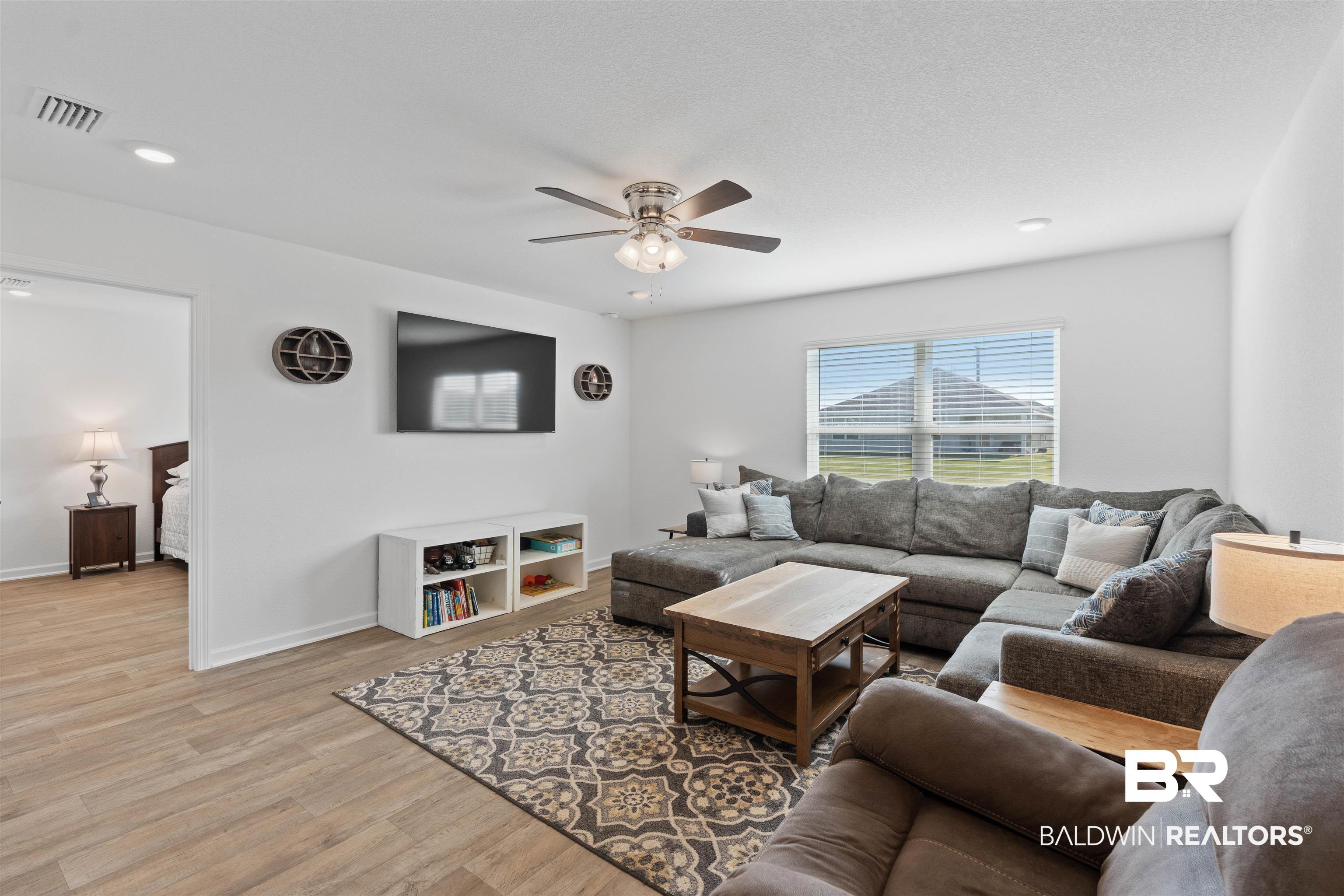 15030 Forsythia Loop Silverhill, AL 36576 - Photo 6 of 33 Living room with light wood-style floors, a ceiling fan, and recessed lighting