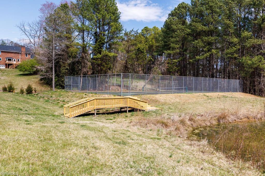 2611 Burke Farm Road Clemmons, NC 27012 - Photo 23 of 24 View of tennis court and pond