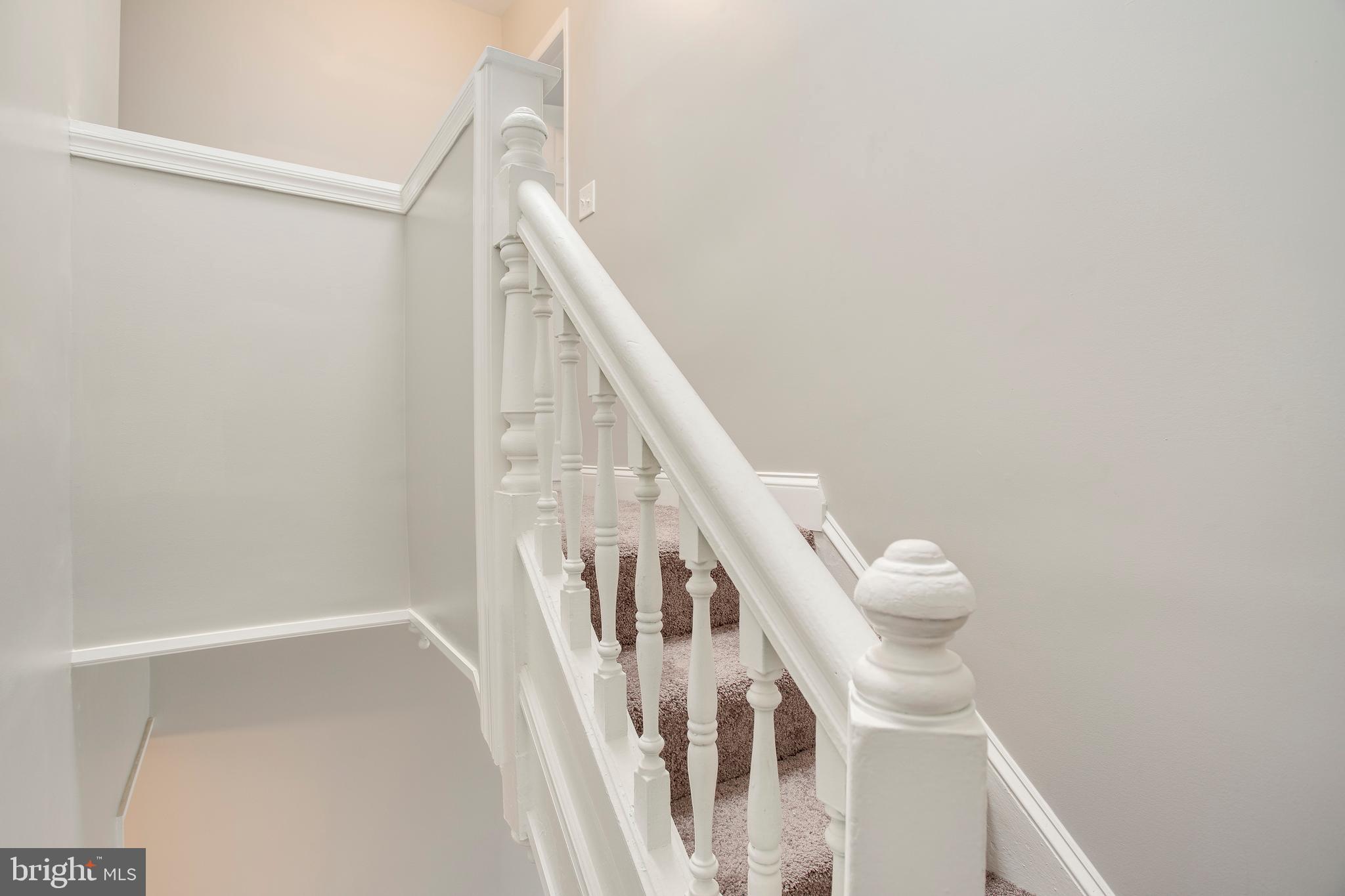 210 South Loudon Avenue Baltimore, MD 21229 - Photo 13 of 28 Original features include charming staircase.